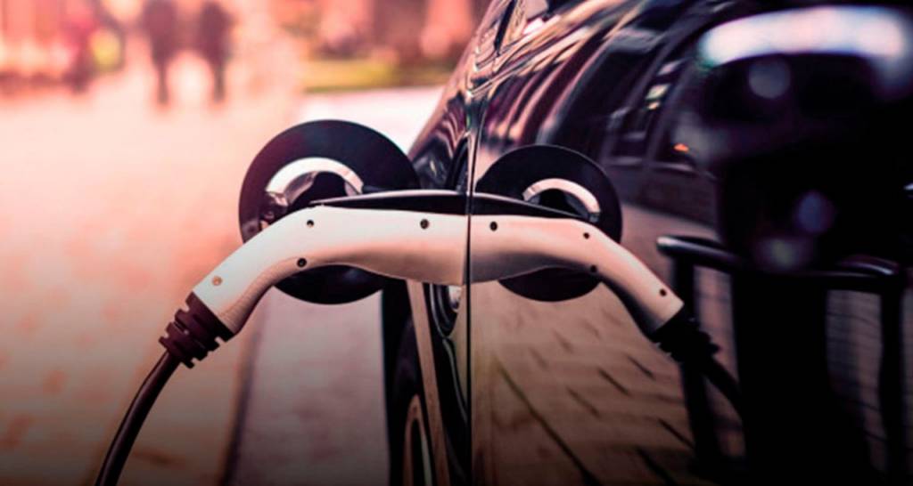 An electric car that's plugged in and charging